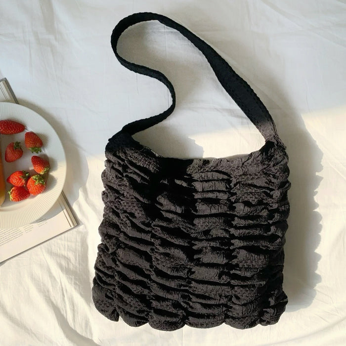 Front view of Bubble Pleat Bag in black, ideal for errands and gifting.