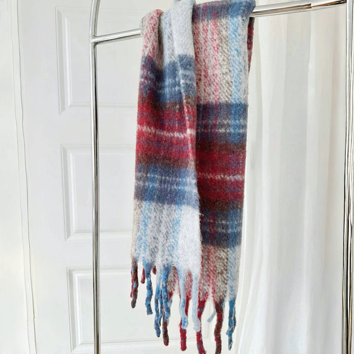 Flat lay of Fiery Sunrise Plaid Scarf in blue and red, ideal for everyday styling and weekend outings.