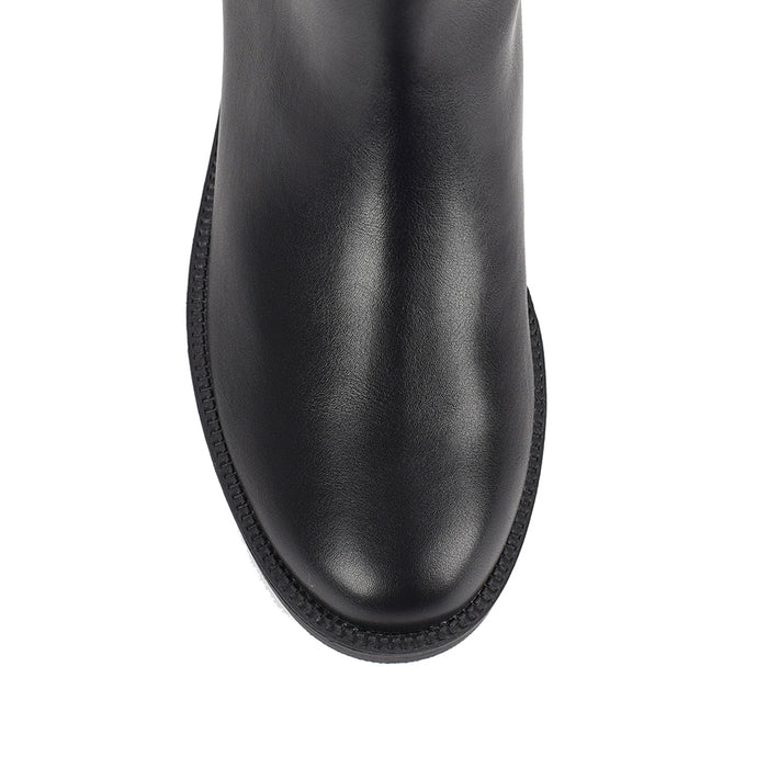 Women's wide calf flat knee high riding boot in black vegan leather