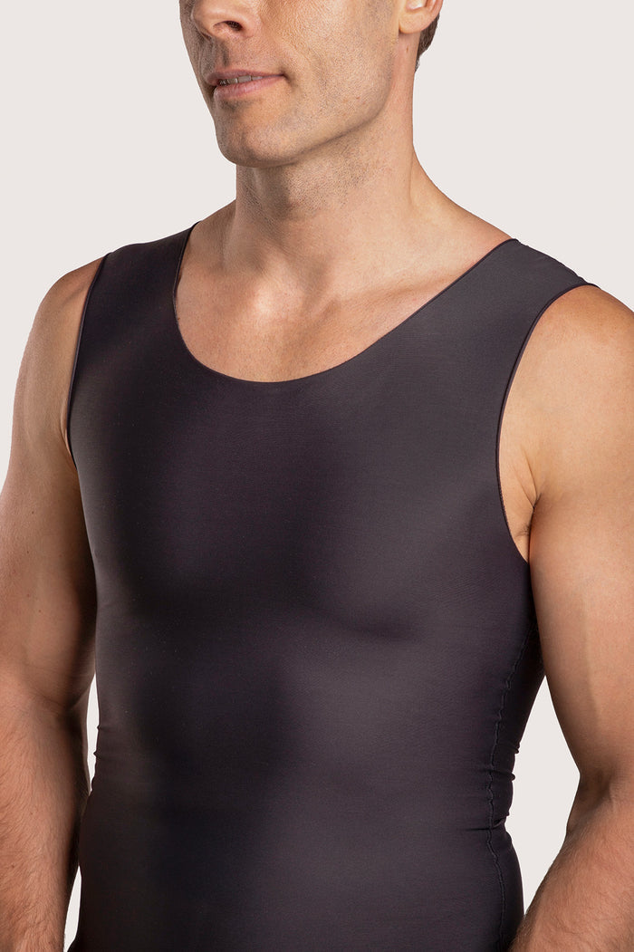 Close-up detail of the black MG04 compression vest, highlighting the breathable medical-grade material and flat-seamed edges for irritation-free wear.