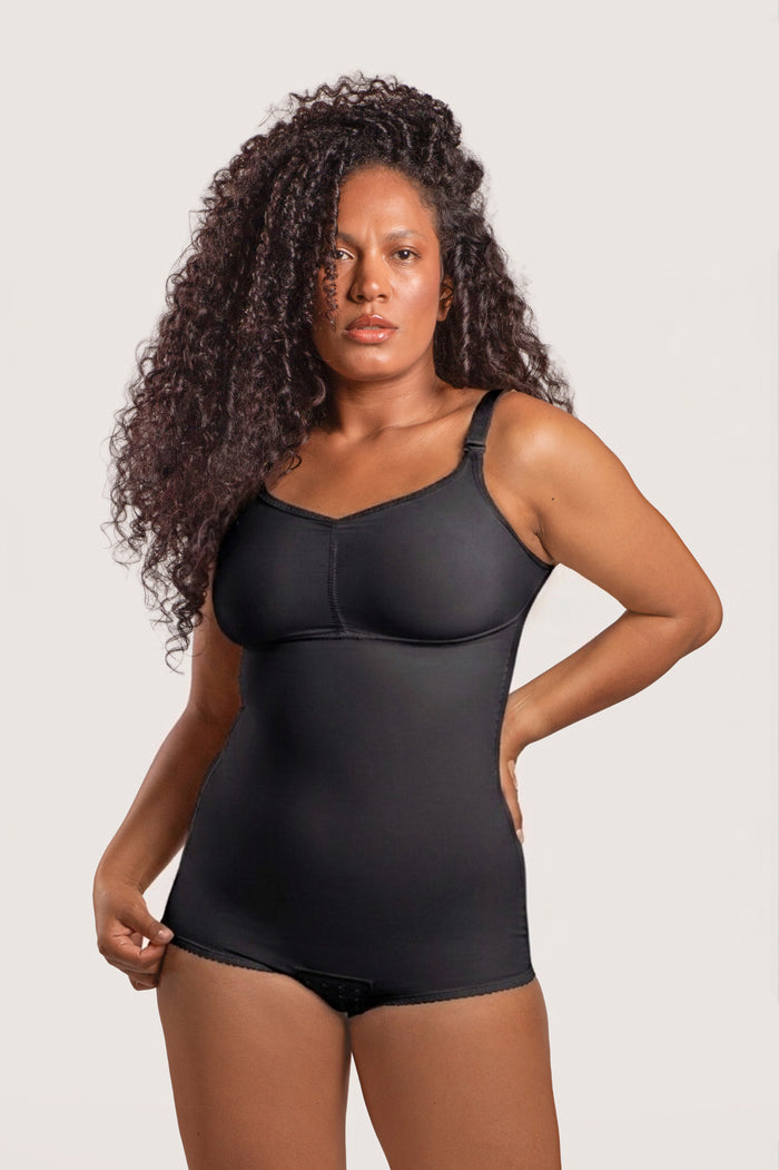 Black shapewear garment worn by a model on a white background