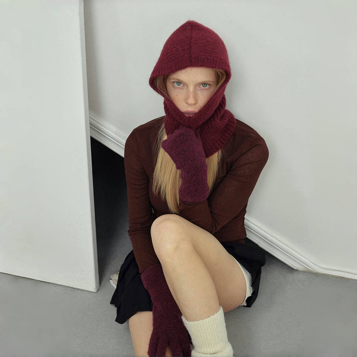 Ancora red knitted wool balaclava hat with matching scarf and gloves set on a model.