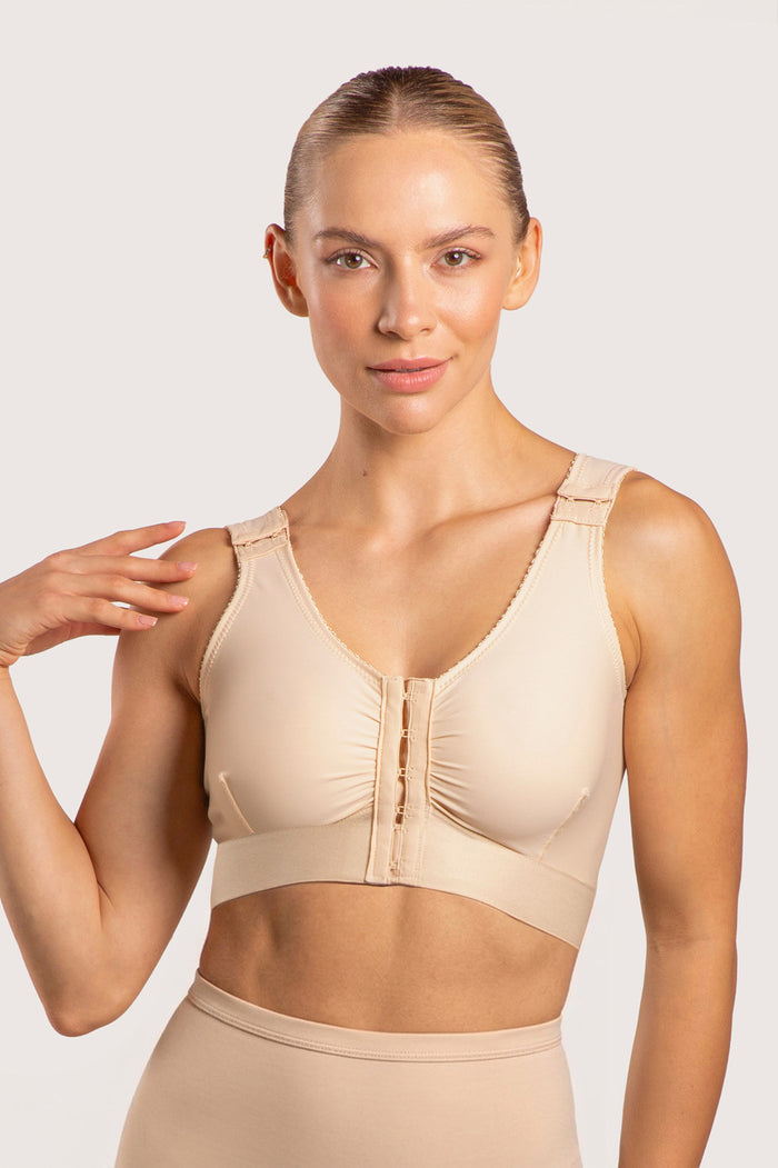 Isavela BR02 Stage 1 surgical bra featuring an integrated 2-inch elastic bust-line for stable breast augmentation and lift recovery, seamless beige medical fabric.