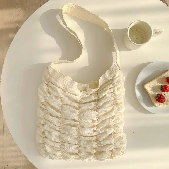 Folded view of Bubble Pleat Bag in white, easy for commuting and weekends.