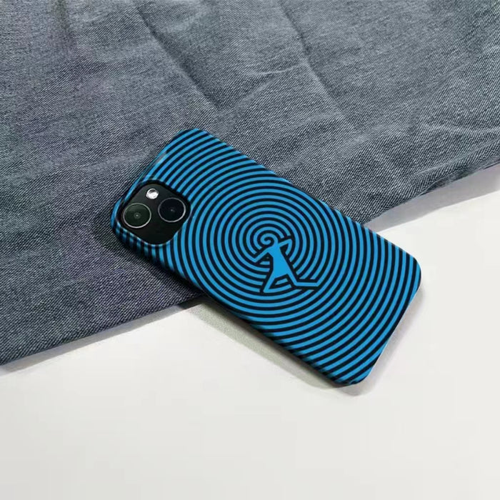 Detailed view of concentric circles and dancing figure on blue silicone case. Creative geometric phone cover.