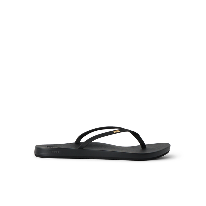 Cushion Slim black flip flop facing left, showing side profile with anatomical arch support and soft cushioning.