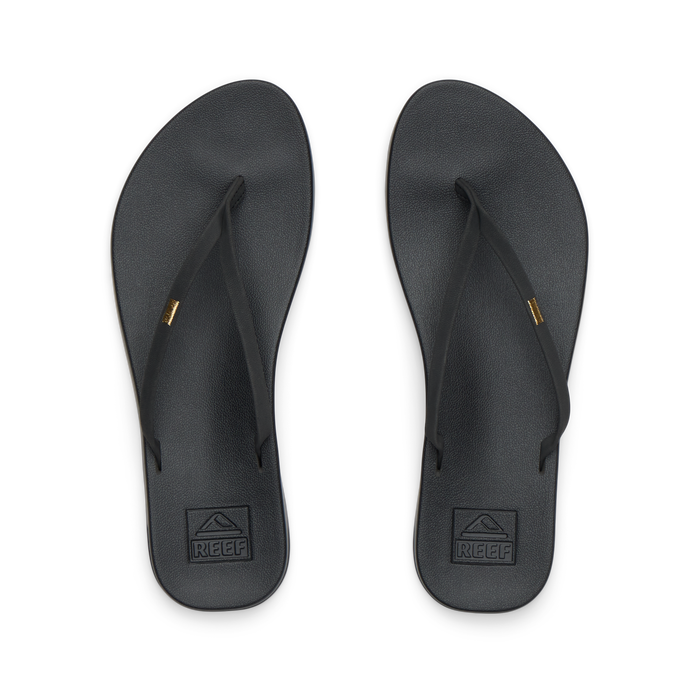 Pair of black Cushion Slim flip flops for women shown from top view, featuring soft-rebound cushioning and anatomical arch support.