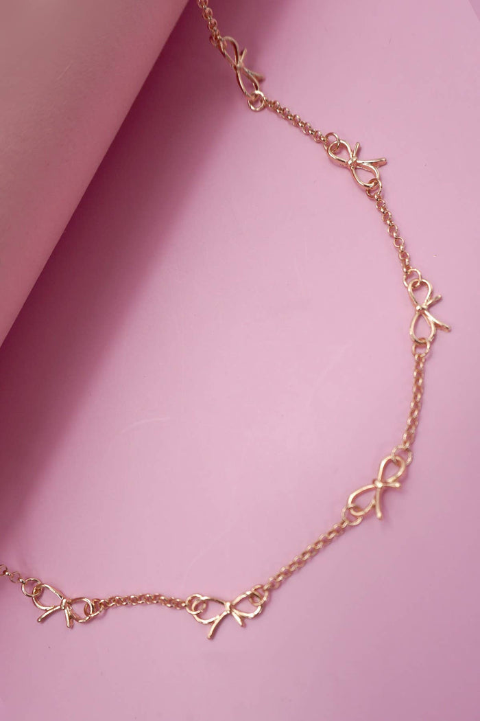 CUTOUT BOW STATION NECKLACE gold gold JOSSLYN by wall to wall- Tilden Co.