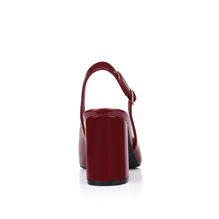 Wine patent high-heeled shoe with a pointed toe shape and buckle closure