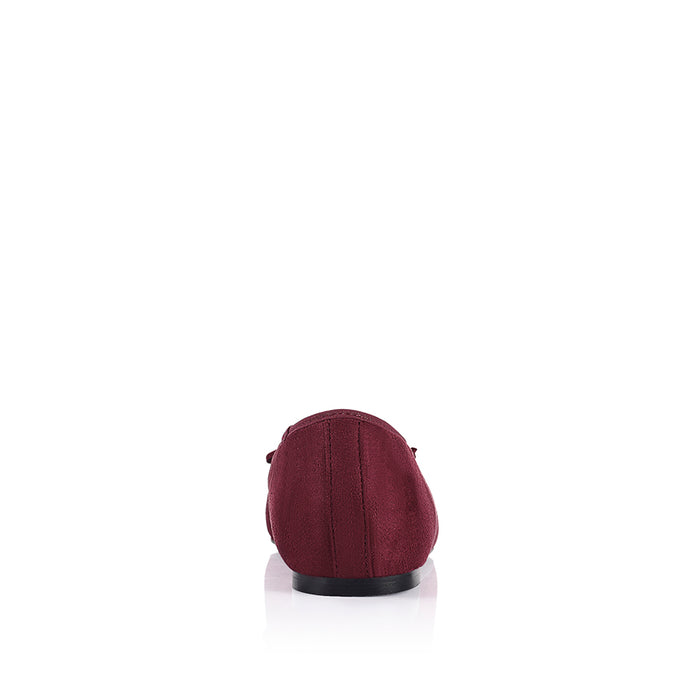 Burgundy microsuede ballet flats with a black heel and small bow