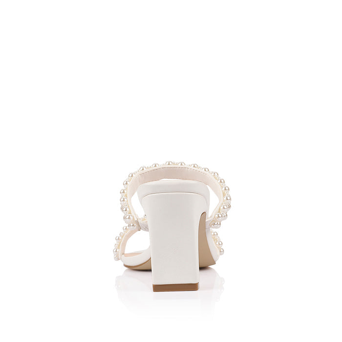 White sandal with pearl embellishments with a square toe shape