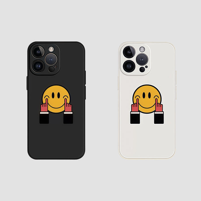 Black and white silicone cases with yellow smiley face giving the middle finger. Funny rebellious aesthetic.