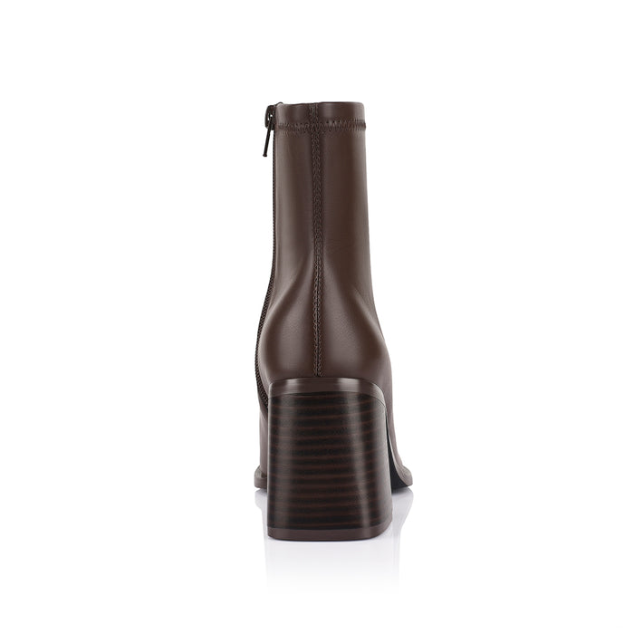 Brown ankle boot with a block heel with a square toe shape and zip closure