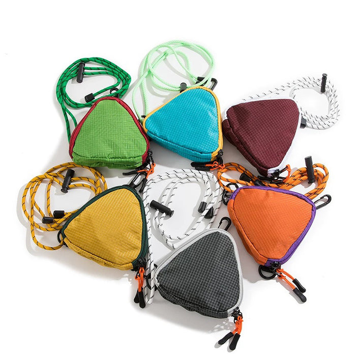 A collection of 6 vibrant colors of the Mini Triangle Multi-Use Bag, showcasing a bold color palette.