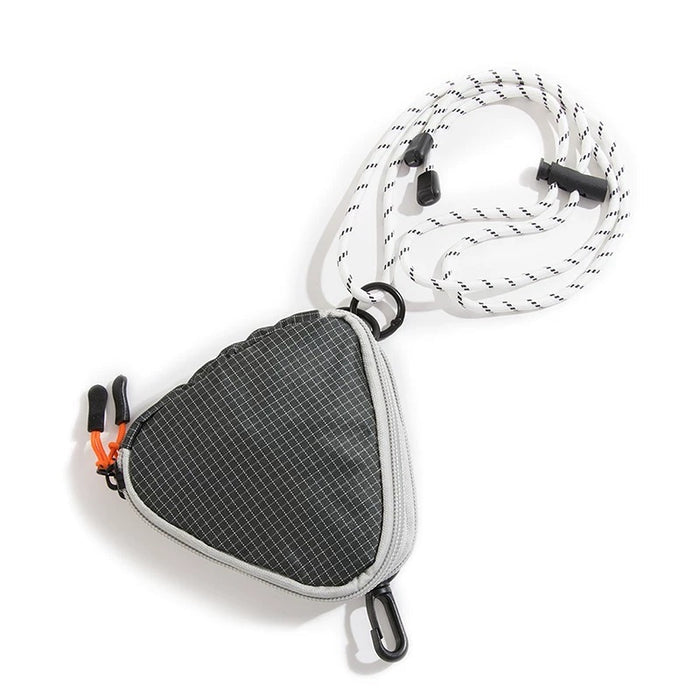 A black triangle mini bag made of durable nylon, featuring a zip-top and adjustable strap.