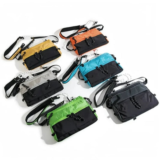 Front view of Six waterproof nylon sling bags in various colors: orange, blue, yellow, grey, green, and black nylon.