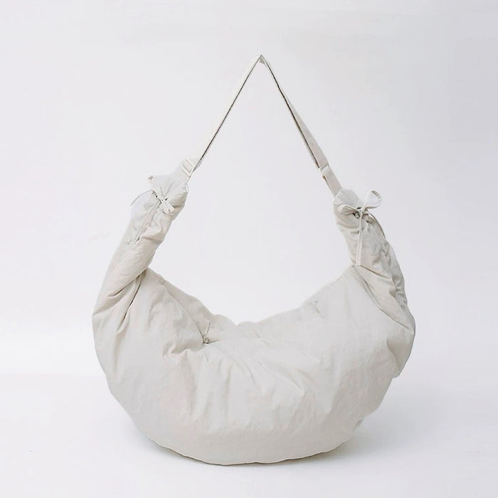 Studio shot of the off-white oversized duvet bag, featuring a soft and lightweight build.