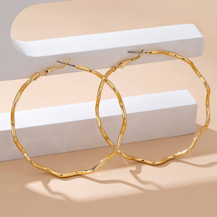 Oversized Hammered Wavy Hoop Earrings | 80E61830 JOSSLYN by wall to wall- Tilden Co.
