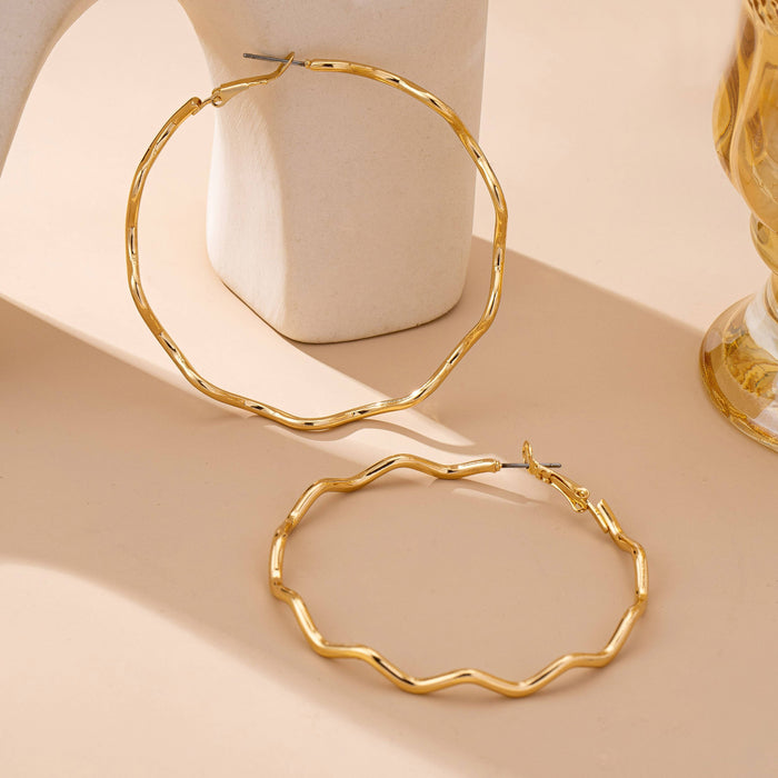 Oversized Hammered Wavy Hoop Earrings | 80E61830 JOSSLYN by wall to wall- Tilden Co.