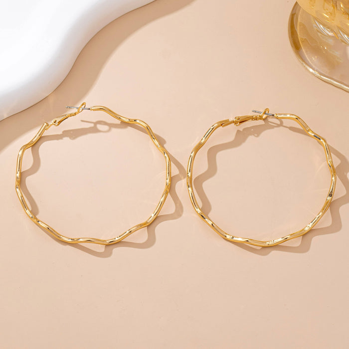 Oversized Hammered Wavy Hoop Earrings | 80E61830 JOSSLYN by wall to wall- Tilden Co.