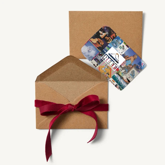 Reef Digital Gift Card with colorful surf-inspired images beside an open kraft envelope tied with a red ribbon.