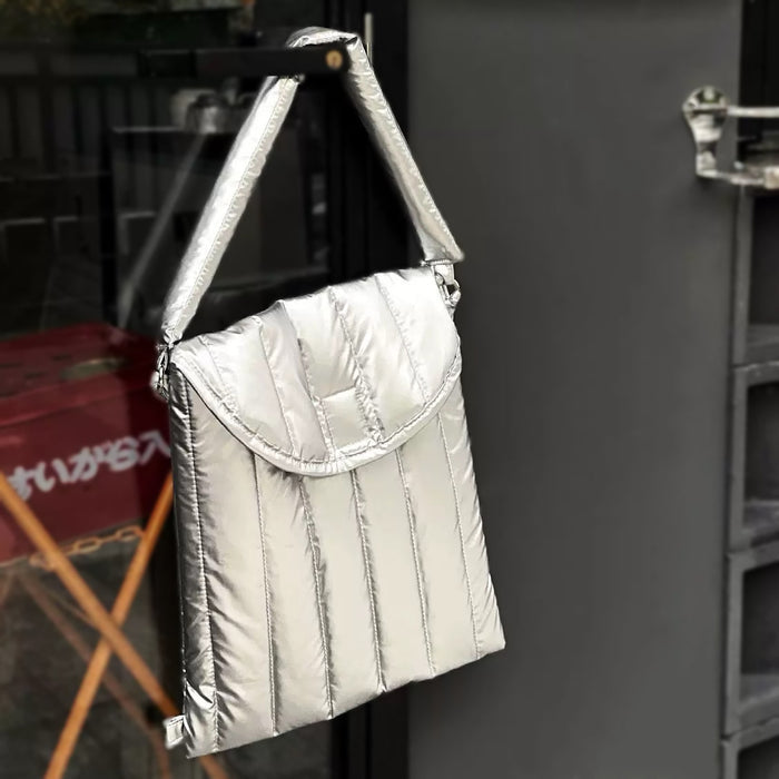 Front view of Silver padded polyester laptop sleeve with removable strap.