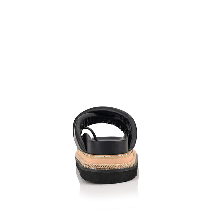 Women's black puffy platform slides with toe ring and contrast sole