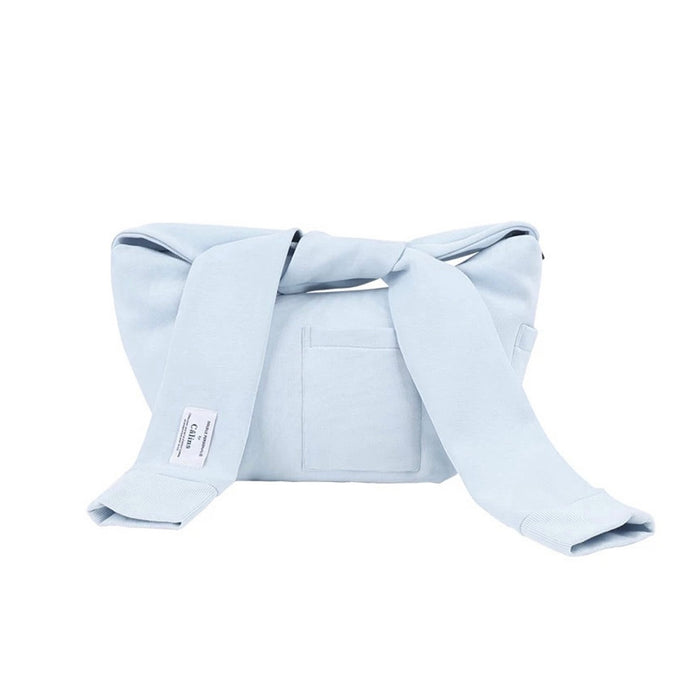 Flat lay of Twist & Tie Sleeve Bag in blue, great for everyday carry and travel.