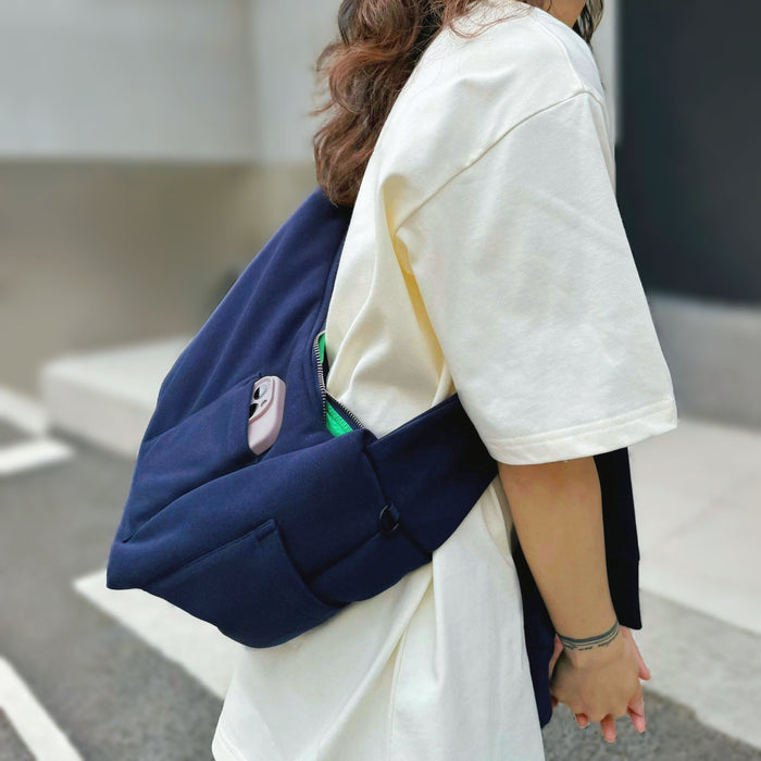Model carrying a cotton Twist & Tie Sleeve Bag as crossbody  easy for commuting and weekends.