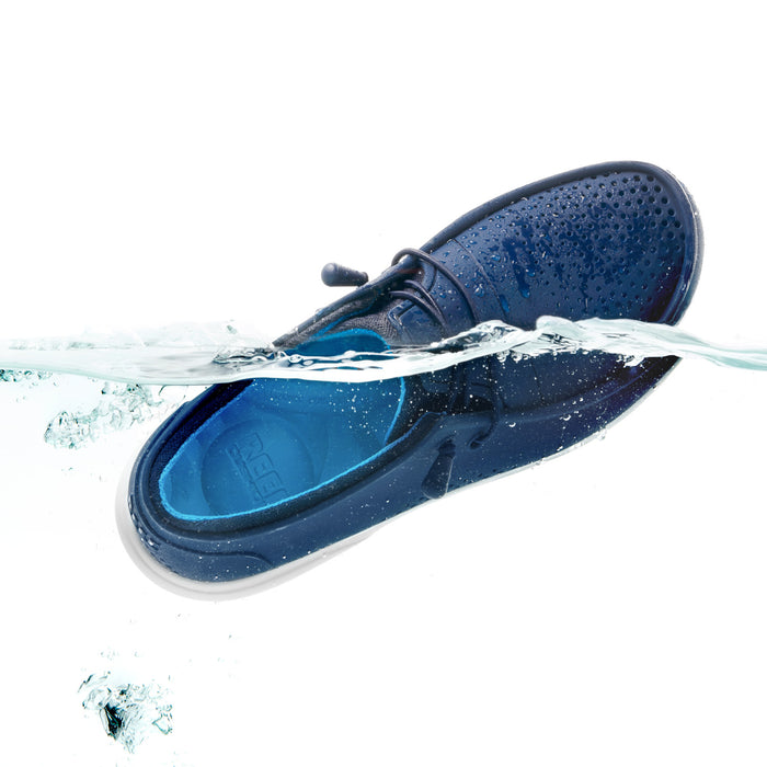 Water Coast men's navy shoe facing left showing top and inner side with water droplets, surf-inspired comfort design.