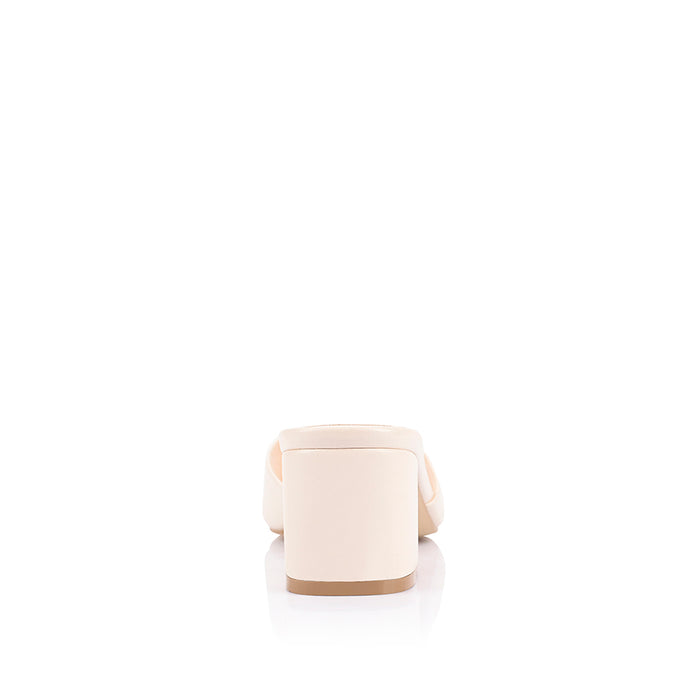 White block heel mule with a square toe shape