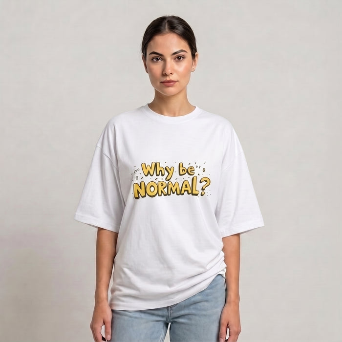 A woman modeling a white drop shoulder t-shirt with a yellow graphic text that reads 'Why be NORMAL?' against a plain light gray background | AH Urban Wear